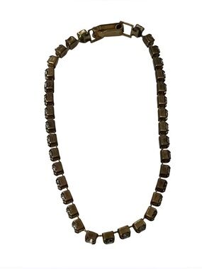 Vintage Rhinestone Tennis Bracelet in Gold Tone Metal.